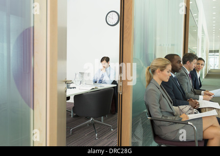 Business people waiting outside office Stock Photo