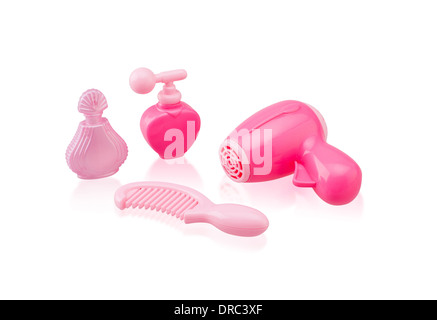 Cute toy hair dryer with comb and perfume bottles isolated on white background Stock Photo