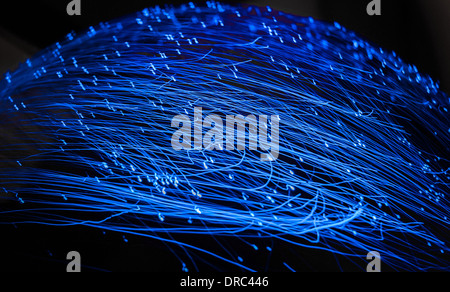 An abstract background from moving fiber optic lights. Stock Photo