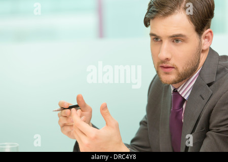 Businessman sitting in office Stock Photo