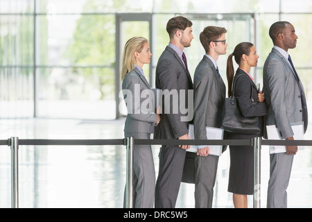 Business people waiting in line Stock Photo