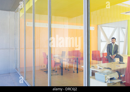 Businessman sitting in office Stock Photo