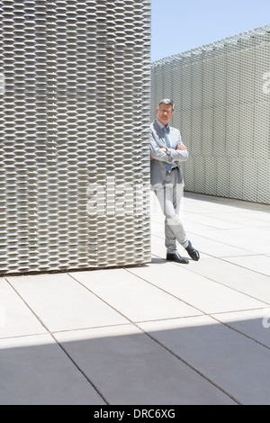 Businessman standing outdoors Stock Photo
