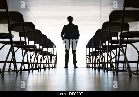 Silhouette of businessman standing in office Stock Photo