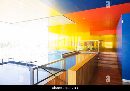 Sun shining through windows in bright office Stock Photo