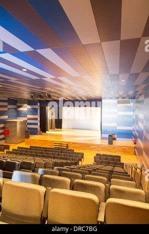 Seats and stage in empty auditorium Stock Photo