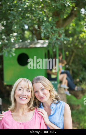 Mother and daughter smiling outdoors Stock Photo