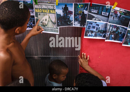 7th Dec, 2013 – Social act brought together activists, journalists and representatives of social movements to debate against police violence and criminalization of slums in Rio. In 2008, Matheus an 8 year old was killed by cop in the favela of Maré, in Rio de Janeiro. Deaths and disappearances of slum dwellers continue to occur due to police action Stock Photo