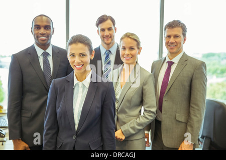 Business people smiling in office Stock Photo