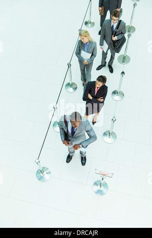 Business people waiting in line Stock Photo