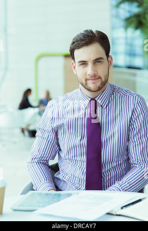 Businessman sitting in office Stock Photo