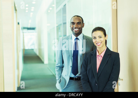 Business people smiling in office Stock Photo
