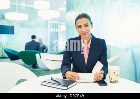 Businesswoman smiling in cafe Stock Photo