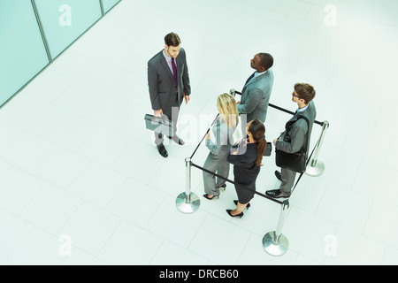 Businessman standing outside roped-off square Stock Photo