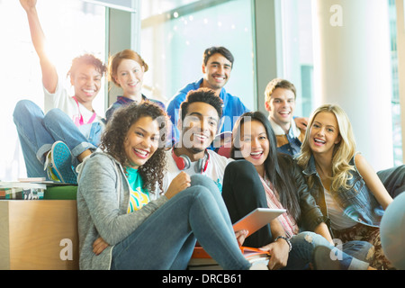 University students laughing together in classroom Stock Photo