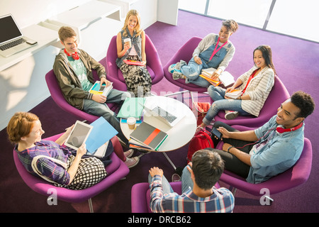 University students talking in circle Stock Photo