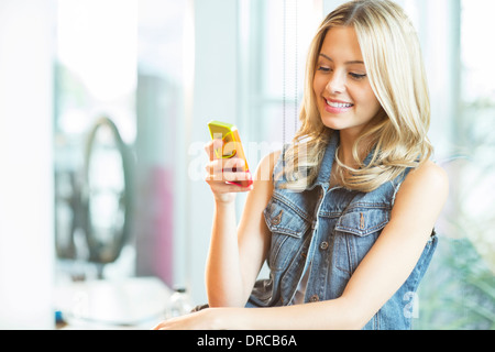 Woman using cell phone Stock Photo