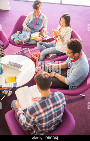 University students reading in lounge Stock Photo