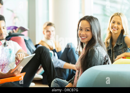 University students smiling in lounge Stock Photo