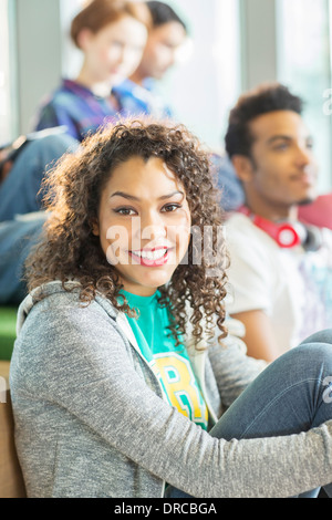 University student smiling in lounge Stock Photo