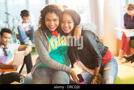 University students smiling together in lounge Stock Photo