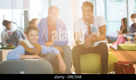 University students smiling in lounge Stock Photo