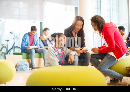 University students talking in lounge Stock Photo