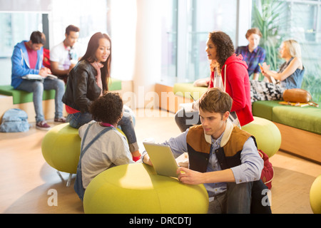 University students relaxing in lounge Stock Photo