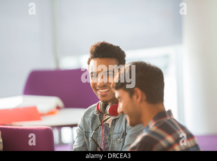 University students talking in lounge Stock Photo
