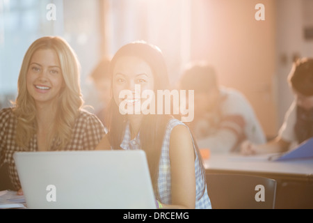 University students smiling in classroom Stock Photo