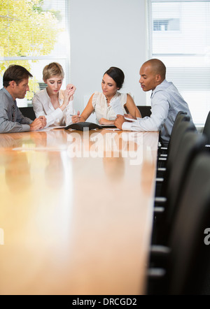 Business people sitting in teleconference Stock Photo