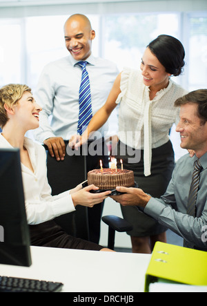 Business people celebrating birthday in office Stock Photo