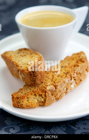 Home made vegan almond biscotti with a cup of coffee. Biscotti is a a twice-baked cake originating in the Italian city of Prato. Stock Photo