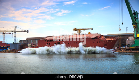 The newly built vessel during launching of the shipyards. Stock Photo