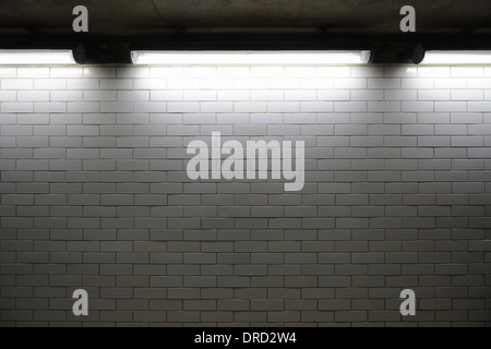 glazed bricks with lights casting shadows from above grunge and dirty look Stock Photo