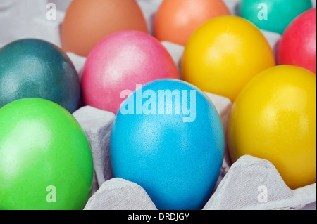 multicolored Easter eggs in the cardboard box Stock Photo