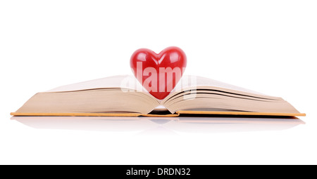 The book of love, a book open with a heart in the middle isolated on a white background Stock Photo
