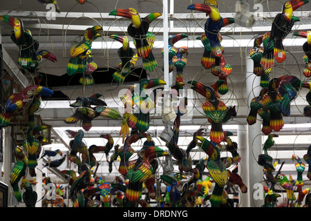 Metal Toucans hang from a store ceiling in Nuevo Progreso, Tamaulipas, Mexico Stock Photo