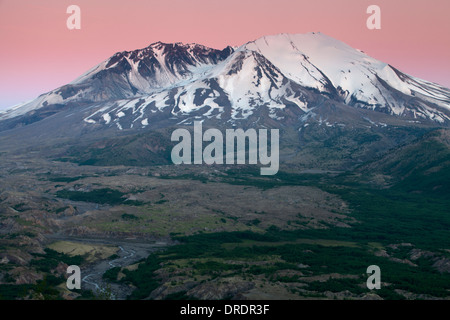 A pink sky above Mount St. Helens after sunset, Mount St. Helens Volcanic National Monument, Washington. Stock Photo