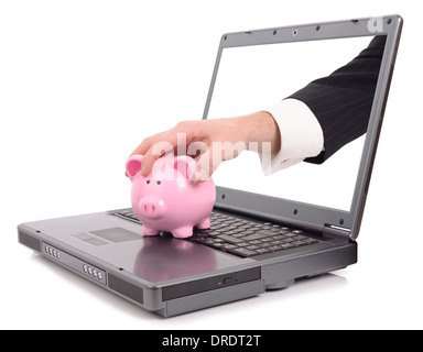 Theft over the internet concept with a hand poping out of the screen to steal a piggy bank, isolated on a white background Stock Photo