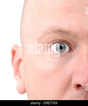 A extreme close up of a man’s face focused on the eye and isolated on a white background Stock Photo