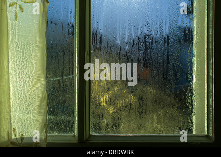 Moonlight through the window. Sweaty glass Stock Photo