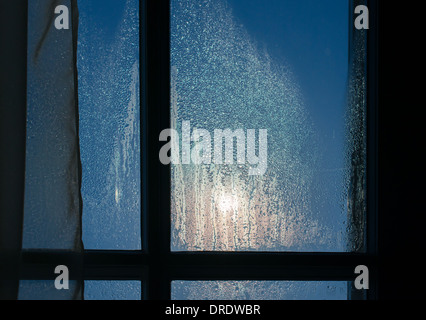 Moonlight through the window. Sweaty glass Stock Photo