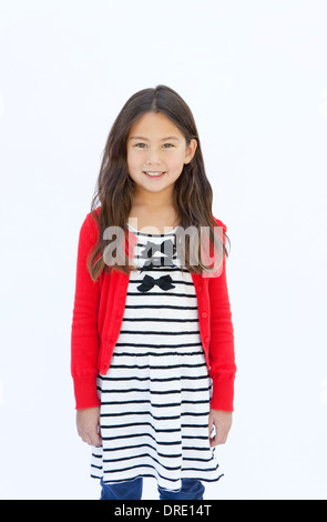 Portrait of young girl in front of white background Stock Photo