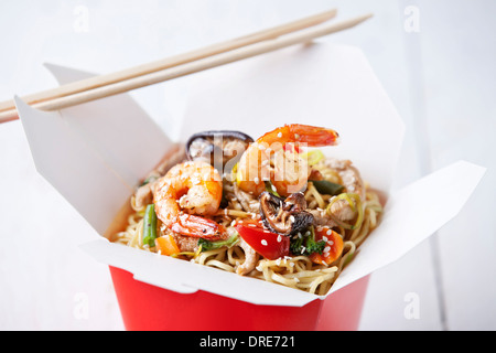 Egg noodles with shiitake mushrooms, shrimp and pork in sweet and sour sauce Stock Photo