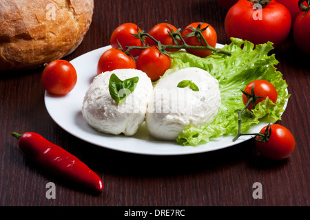 Fresh italian mozzarella with vegetables and tomatoes Stock Photo
