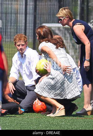Prince Harry and Catherine, Duchess of Cambridge, aka Kate Middleton   on the football pitch at Bacon's College  London, England - 26.07.12 Stock Photo