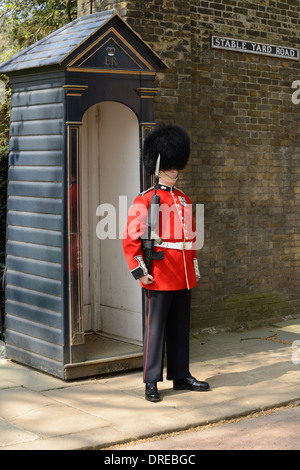 Queens Guard on Sentry Duty on the Stable Yard Road Entrance to Clarence House, London, England, United Kingdom. Stock Photo