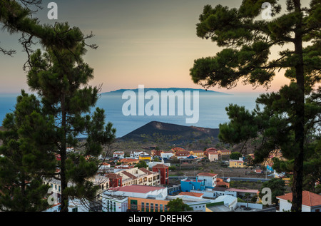 View at sunset over the town of Los Canarios and Volcan San Antonio in southern La Palma towards the island of El Hierro Stock Photo