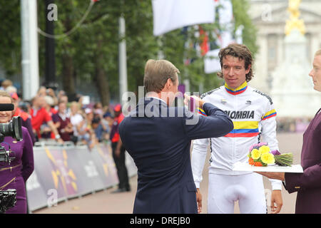 Silver medallist Rigoberto Uran Uran of Colombia presented by Grand Duc of Luxembourg Henri  during the Victory Ceremony for the Men's Road Race Road Cycling on day 1 of the London 2012 Olympic Games London, England - 28.07.12 Stock Photo